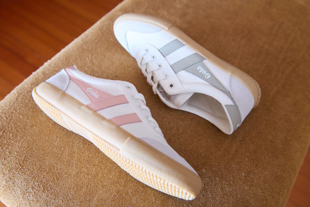 women's Badminton plimsoll styles on a gym horse in an indoor sports hall