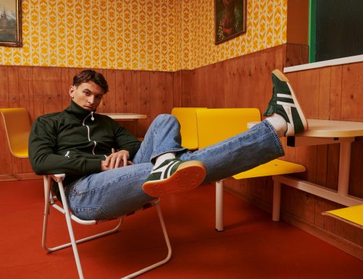 A close up of a man dressed in terracewear wearing a pair of Harrier trainers